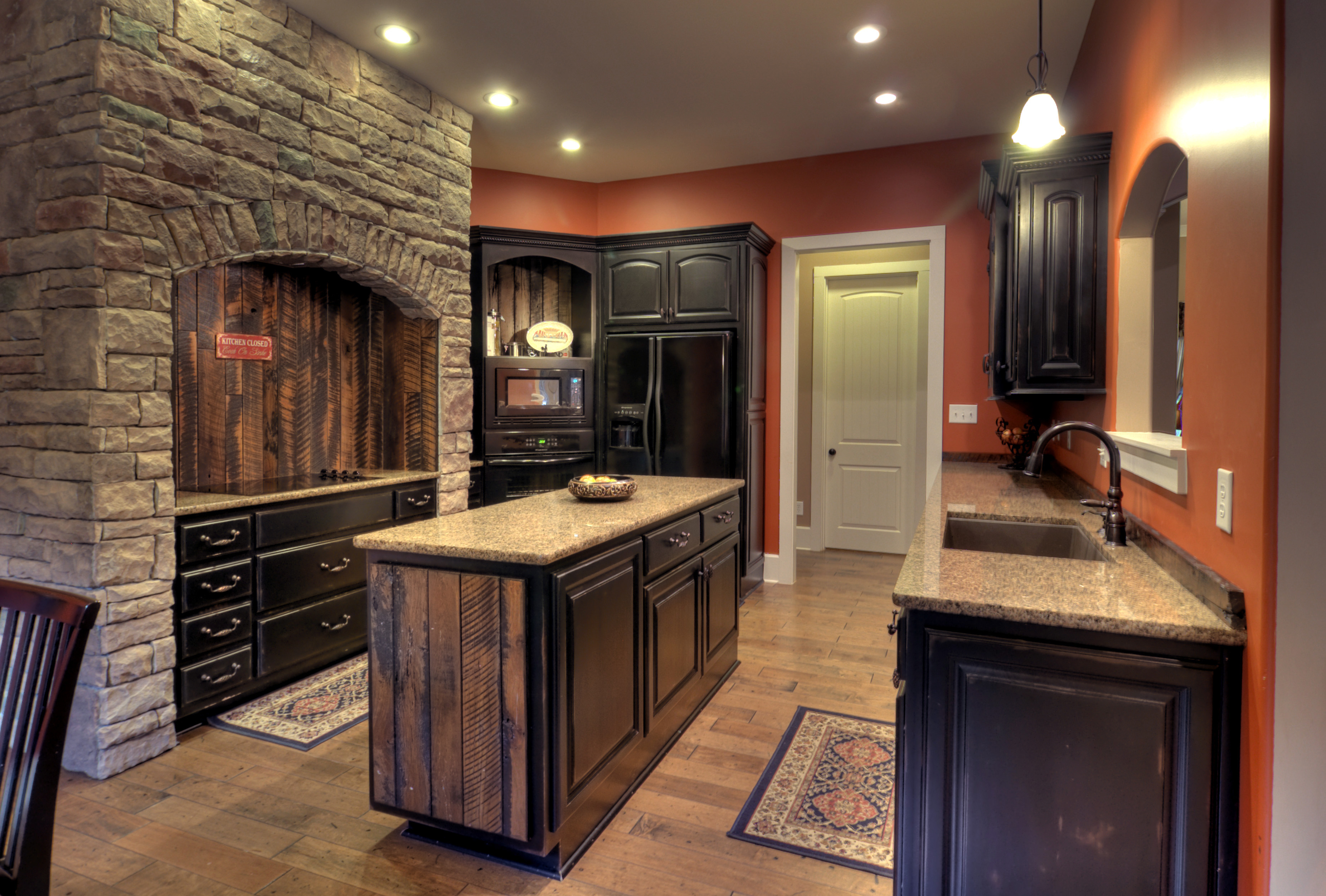 Black distressed with barn wood accents – Kirkland Cabinets & Innovations